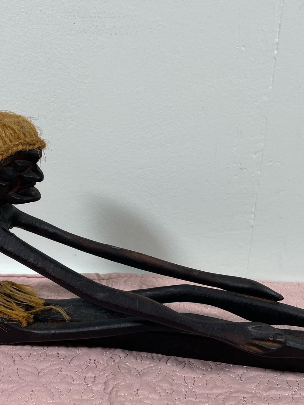 Hand-Carved Black Wooden Tribal Figurine with Natural Fiber Accents
